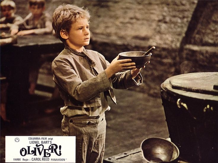 Mark Lester, actor, holding a bow