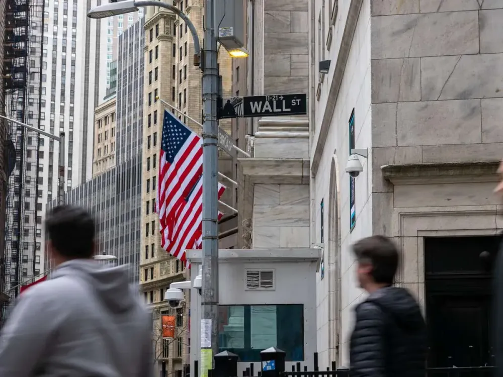 People walk by the New York Stock Exchange