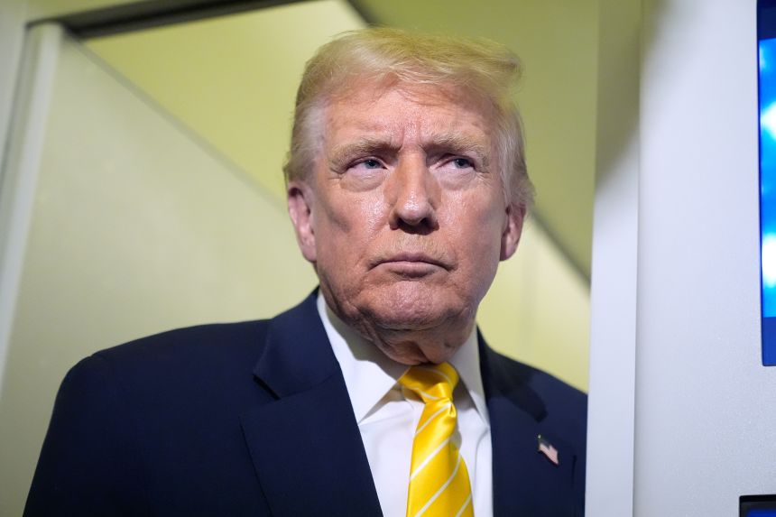 President Donald Trump speaks to reporters on Air Force One on his way to his Mar-a-Lago estate in Palm Beach, Fla., Friday, Nov. 14, 2025.