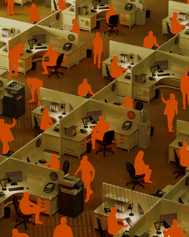 Silhouettes of workers in empty office cubicles