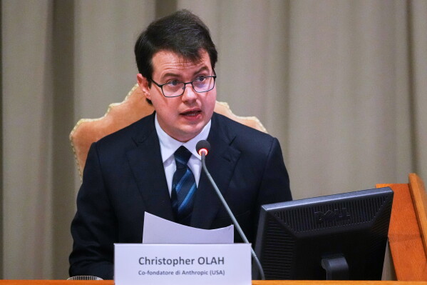 Anthropic co-founder Christopher Olah speaks during the presentation of Pope Leo XIV's first encyclical