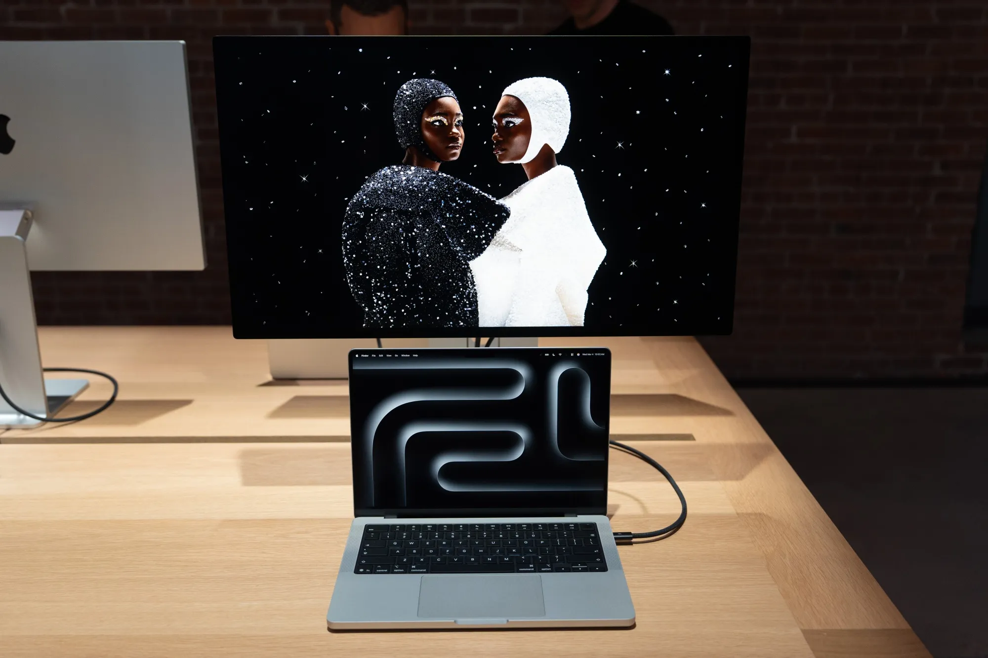 Apple 14-inch MacBook Pro with M7 chip running on-device AI inference tasks