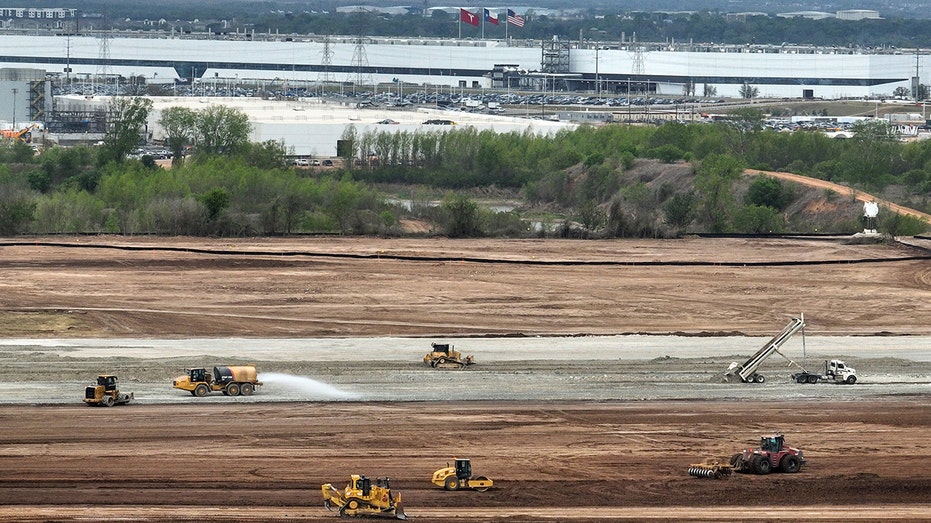 Construction progress on the Tesla Terafab facility at Giga Texas, showcasing the massive scale of the project.