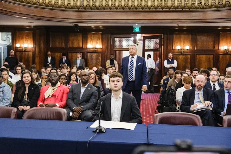 Anthropic whistleblower Jacob Coxon testifying at a City Council hearing on Oct. 5, 2026
